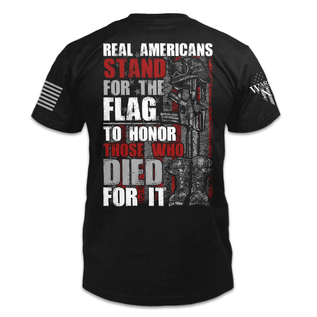 A black t-shirt with the words "Real Americans Stand For The Flag To Honor Those Who Died For It!" printed on the back of the shirt.