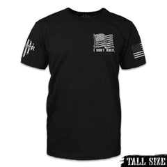 A black tall size shirt with the words "I don't kneel" and an American flag printed on the front.
