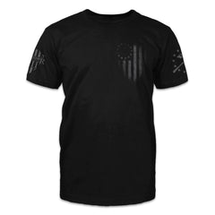 A black t-shirt with the betsy ross flag printed on the front of the shirt.