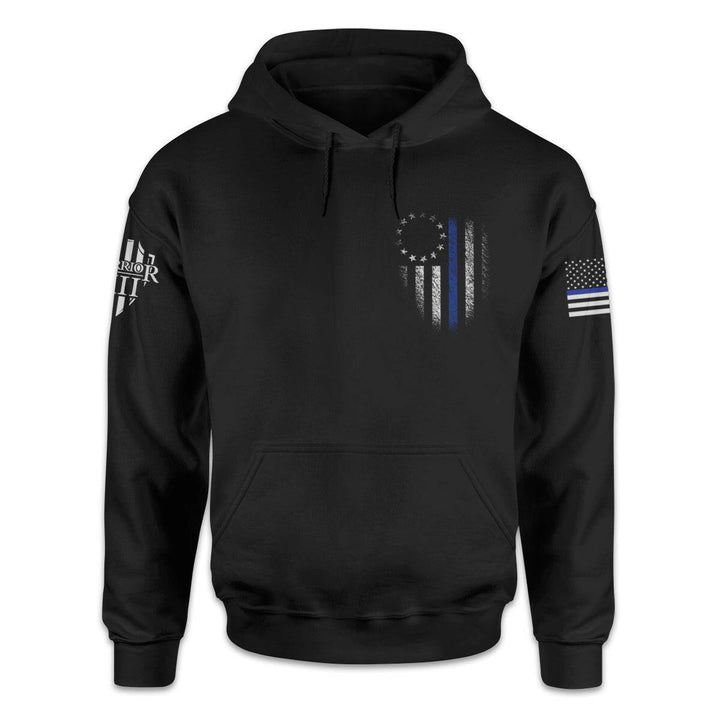 A black hoodie with the thin blue line betsy ross flag printed on the front left chest of the shirt.