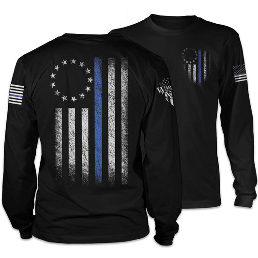 Front & back black long sleeve shirt that features a thin blue line Betsy Ross flag on a back print to show that we remain undeterred in our support for American law enforcement. printed on the shirt.