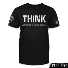 A black tall size shirt with the the words "Think While It's Still Legal" printed on the front of the shirt.