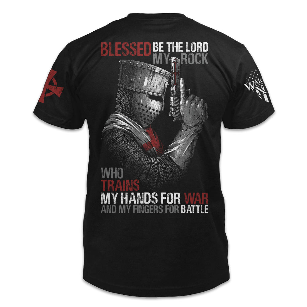 A black t-shirt with the words "Blessed be the lord, my rock, who trains my hands for war and my fingers for battle" with a crusader holding a gun printed on the back of the shirt.