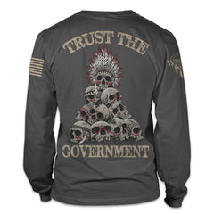 A dark grey long sleeve shirt with the words "Trust the government" printed on the back of the shirt.