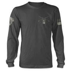 A dark grey long sleeve shirt with two AR15's crossed over printed on the front left side of the chest.