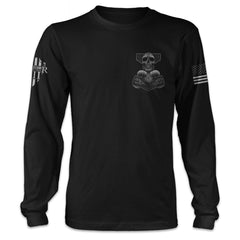 A black long sleeve shirt features a Thor's hammer skull design. The ram skull symbolizes the rams that pulled Thor's chariot printed n the front left chest.