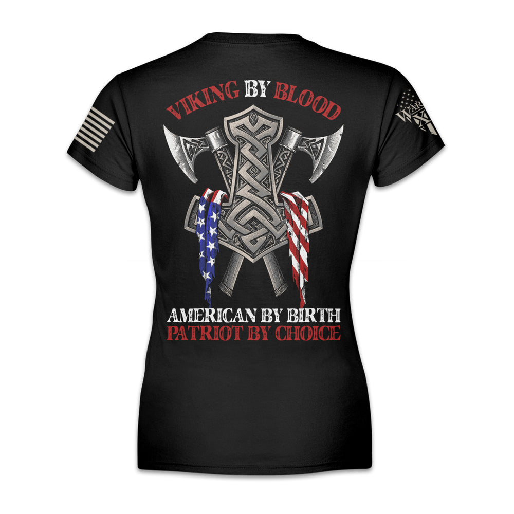 A black women's relaxed fit'shirt with the words "Viking by blood, American by birth, patriot by choice" with viking axes printed and an American flag printed on the back of the shirt.