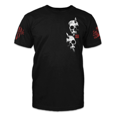 A black t-shirt with two skulls printed on the front left of the chest.