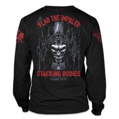 A black long sleeve shirt with the words "Vlad The Impaler, Stacking bodies since 1456" with a Vlad printed on the back of the shirt.