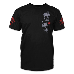 A black t-shirt with two skulls with arrows through them printed on the front of the shirt.